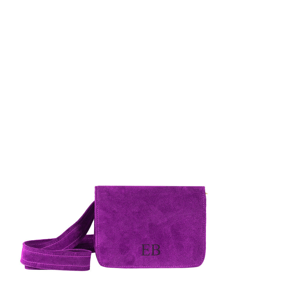 Purple suede crossbody bag with initials EB embossed on the front