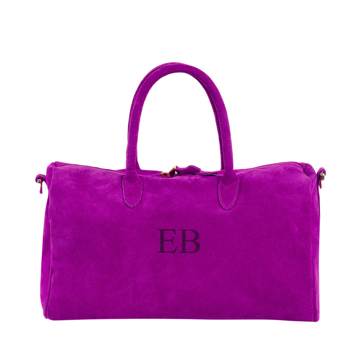 Bright pink suede handbag with EB initials on front