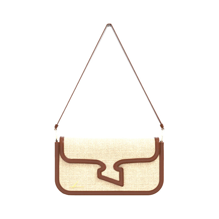 Beige linen handbag with brown leather trim and a shoulder strap