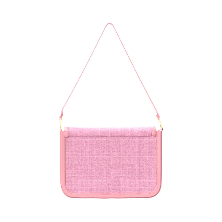 Pink crossbody bag with textured fabric and adjustable strap