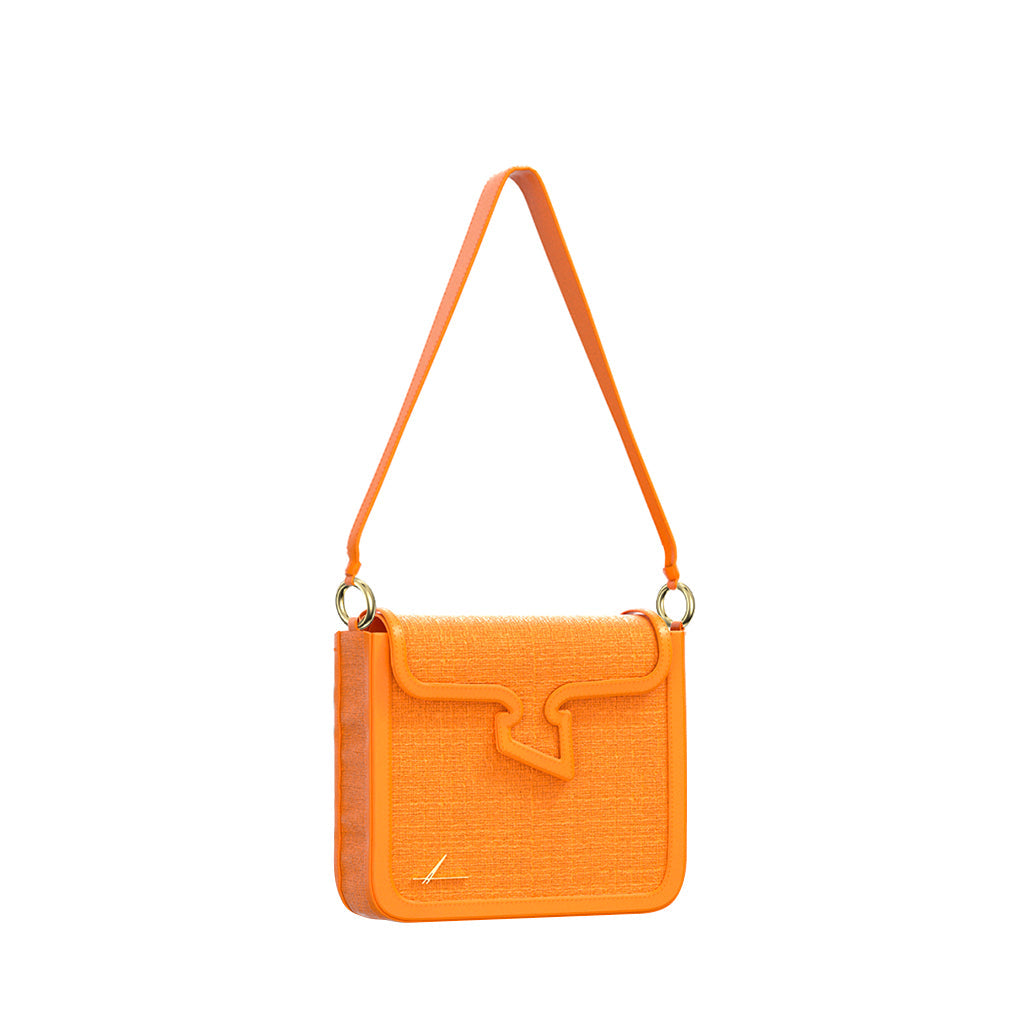 Orange textured shoulder handbag with unique flap design and adjustable strap
