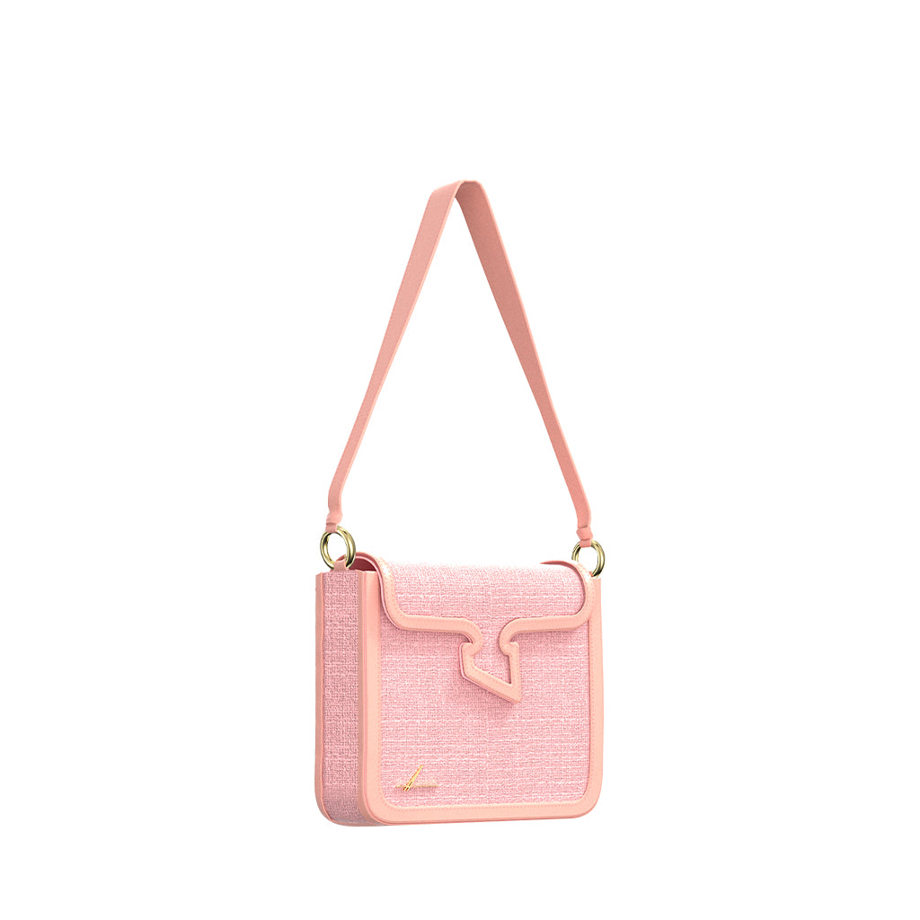 Pink designer shoulder bag with textured fabric and gold accents