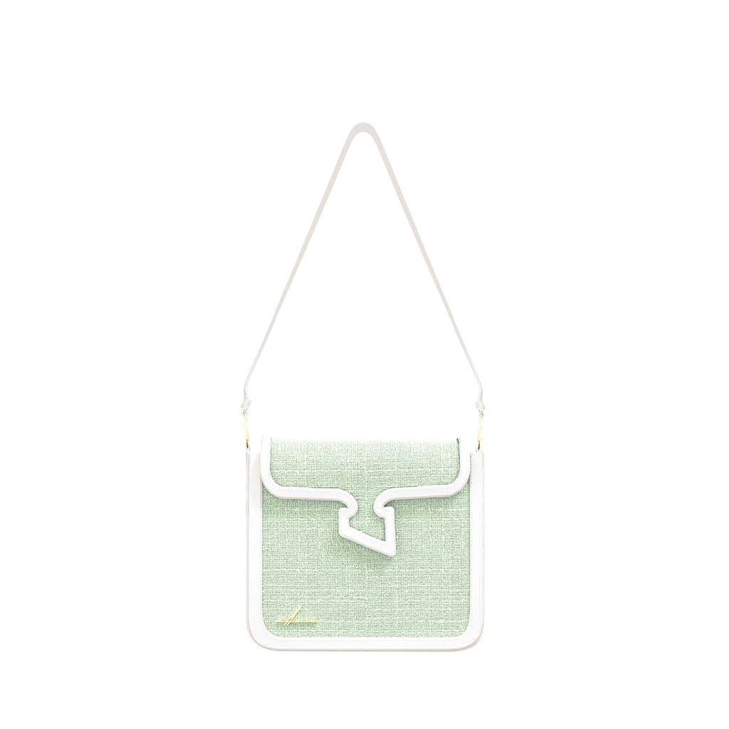 Light green crossbody handbag with white strap and trim on a plain white background
