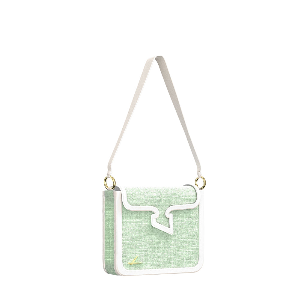 Pastel green crossbody bag with white trim and gold hardware