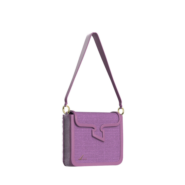 Purple shoulder handbag with textured surface and unique flap design