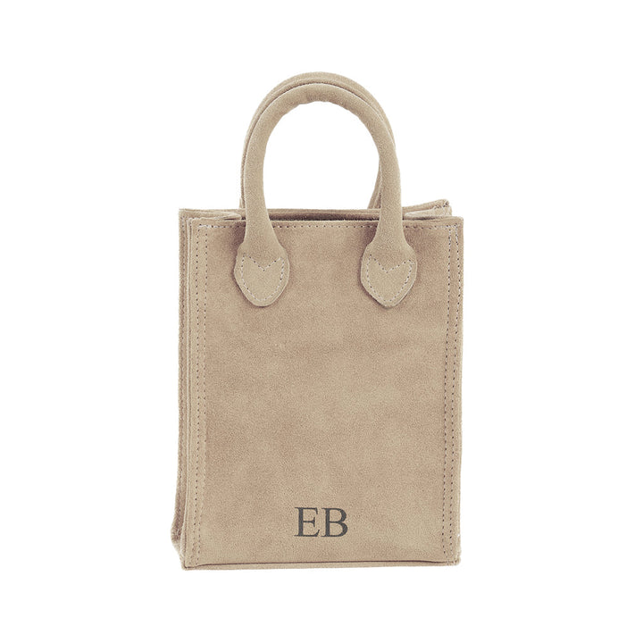 Beige suede handbag with initials â€˜EBâ€™ on the front