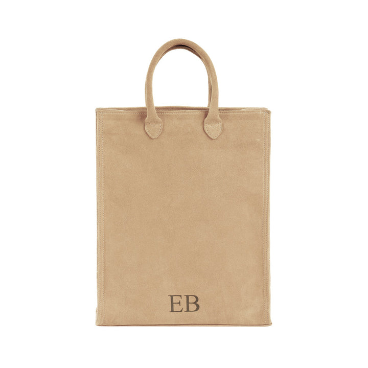 Beige suede tote bag with initials EB embroidered on the front