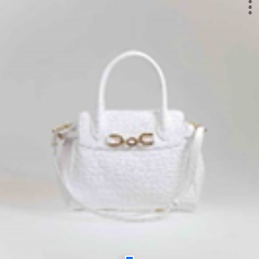 White textured handbag with gold hardware and adjustable strap