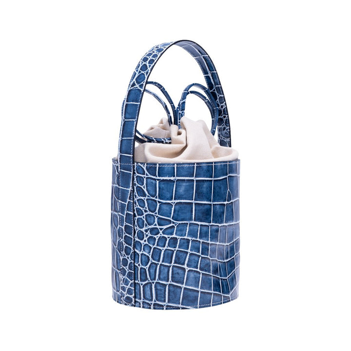 Blue crocodile patterned bucket bag with beige interior