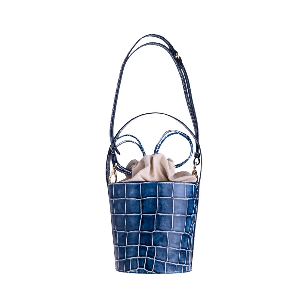 Blue crocodile-pattern bucket bag with adjustable strap and beige interior