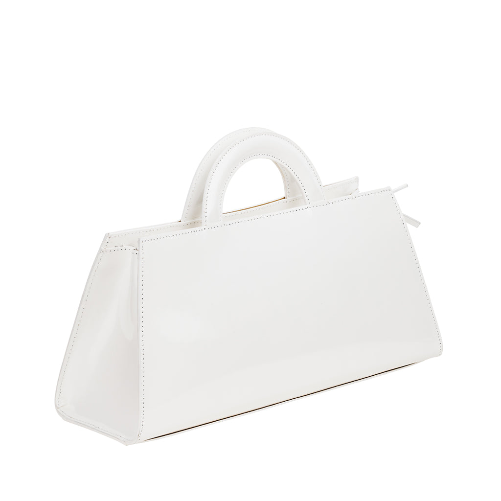 White geometric handbag with structured handles and a sleek finish