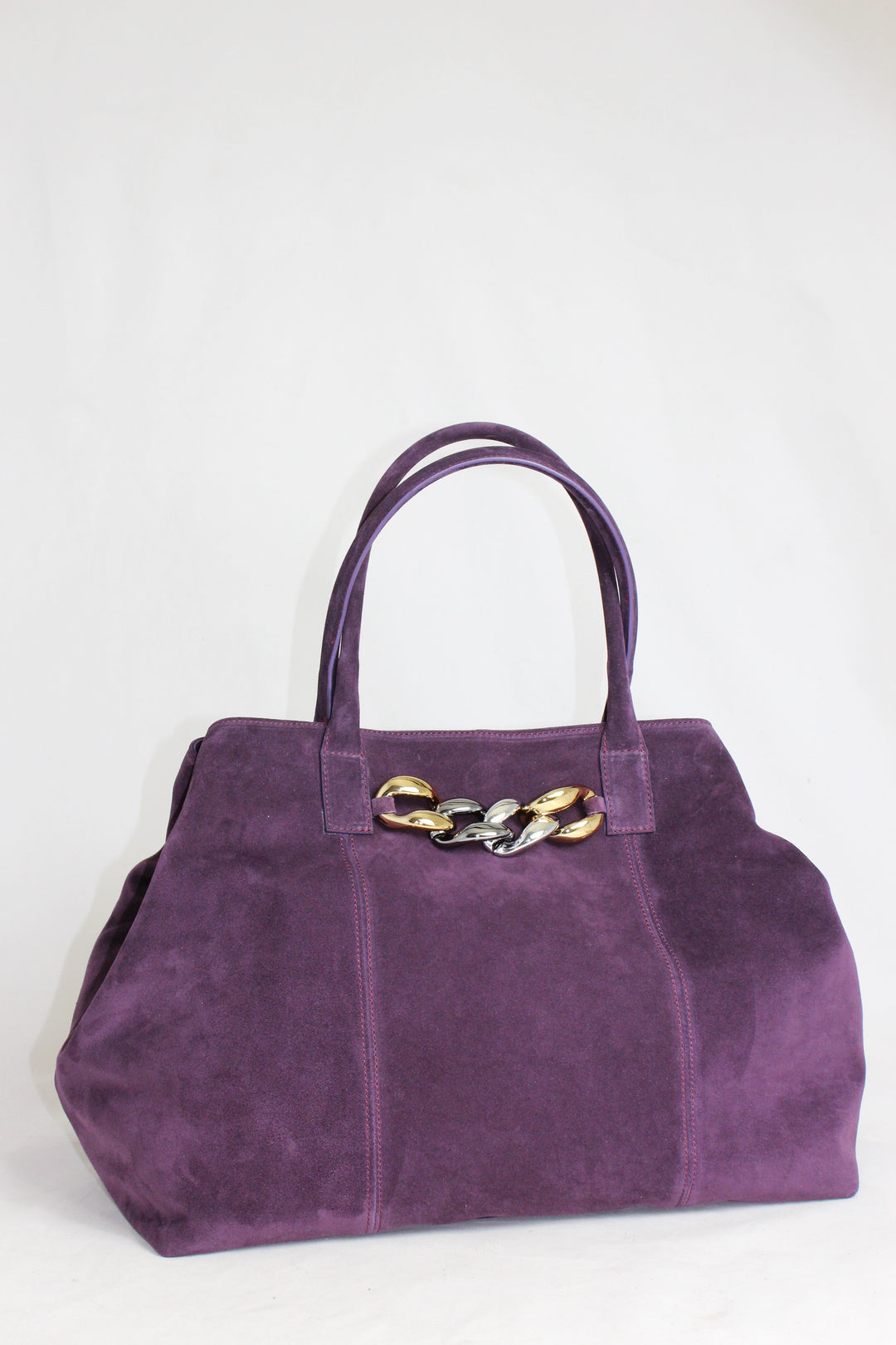 Luxury purple suede handbag with gold and silver chain accents