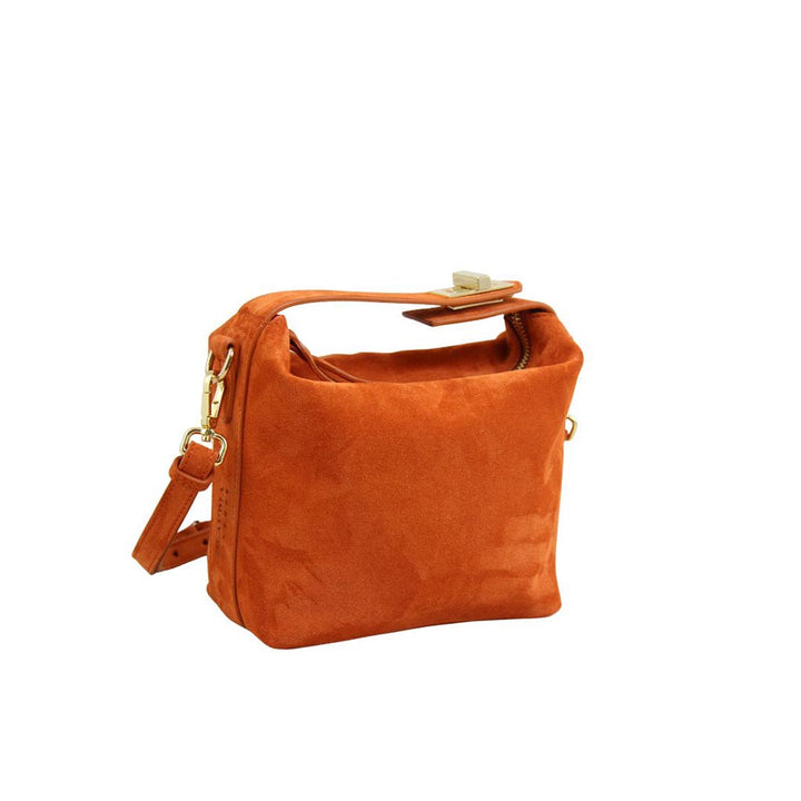 Rust-colored suede handbag with gold accents and adjustable strap