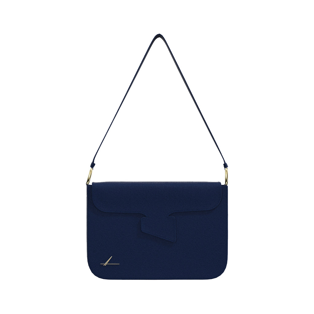 Navy blue designer shoulder bag with gold accents
