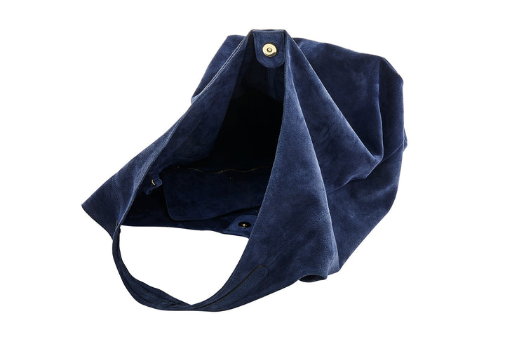 Dark blue suede handbag with open magnetic closure and spacious interior
