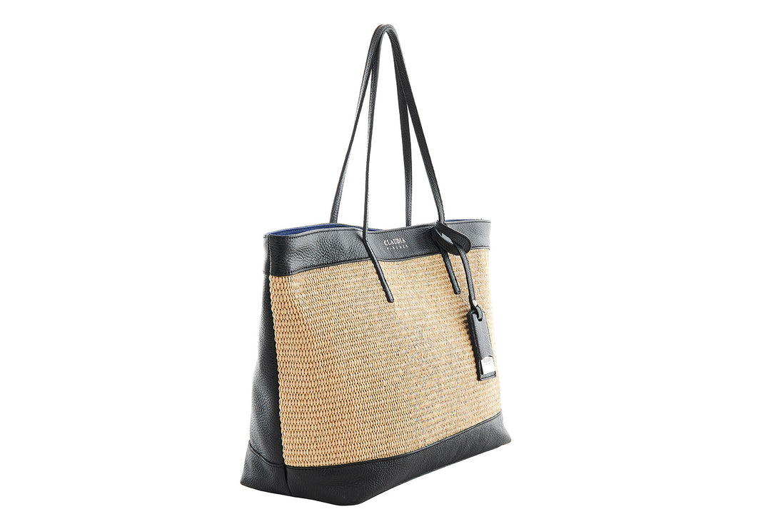 Woven straw and black leather tote bag with long black handles