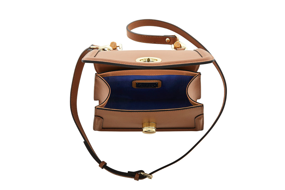 Brown leather crossbody bag with open flap and blue interior lining