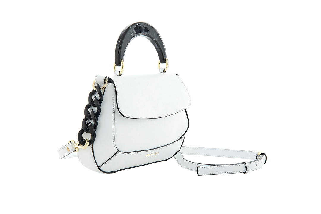 White leather handbag with black accents and a chain strap