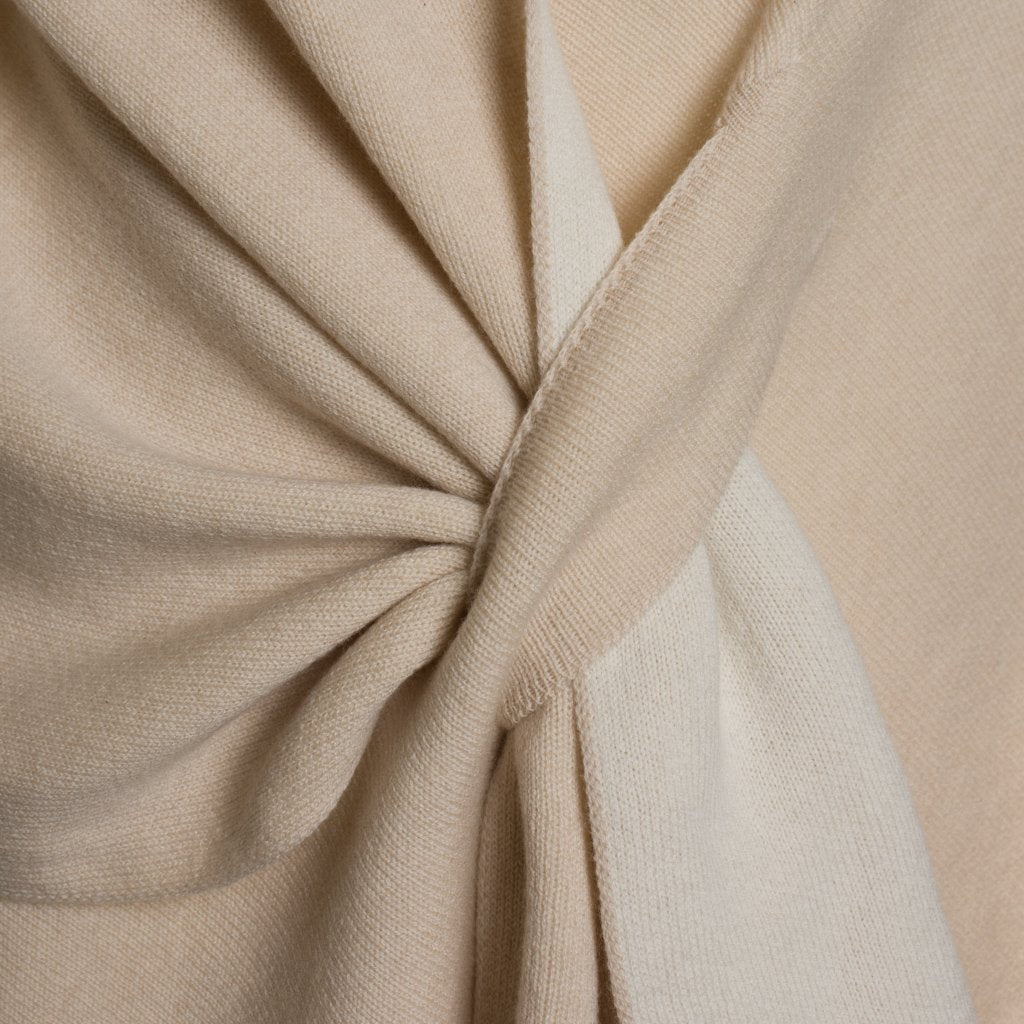 Close-up of beige twisted fabric showcasing texture and design