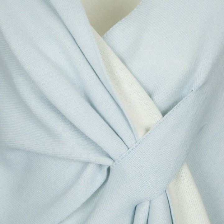 Close-up of light blue fabric wrapped in a knot