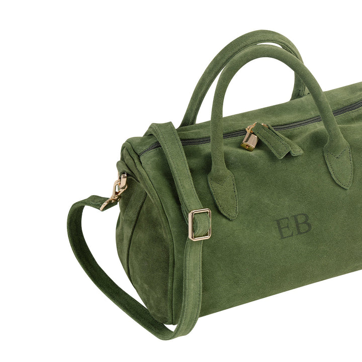 Green suede handbag with gold hardware and monogrammed initials EB, featuring a shoulder strap and top handles