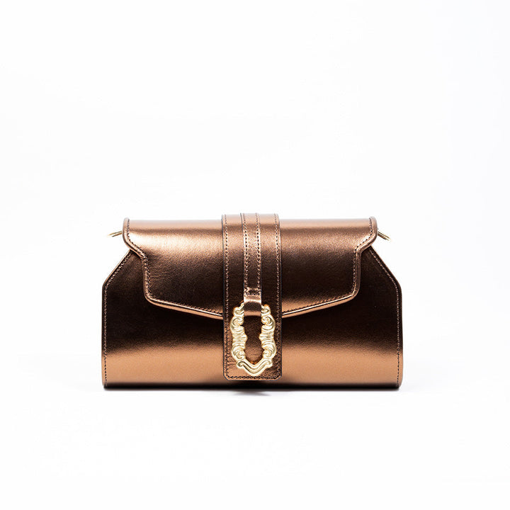 Bronze metallic leather handbag with decorative clasp on white background