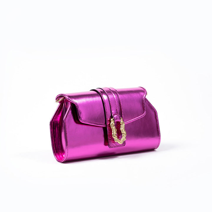 Shiny pink clutch purse with gold clasp on white background