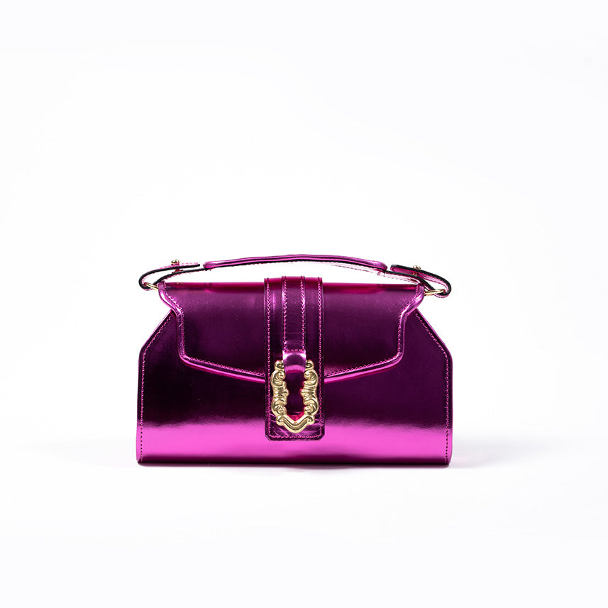 Shiny purple handbag with gold buckle and top handle on white background