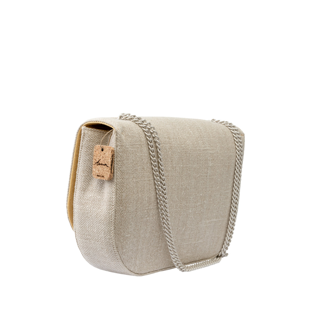 Beige linen crossbody bag with chain strap and cork tag