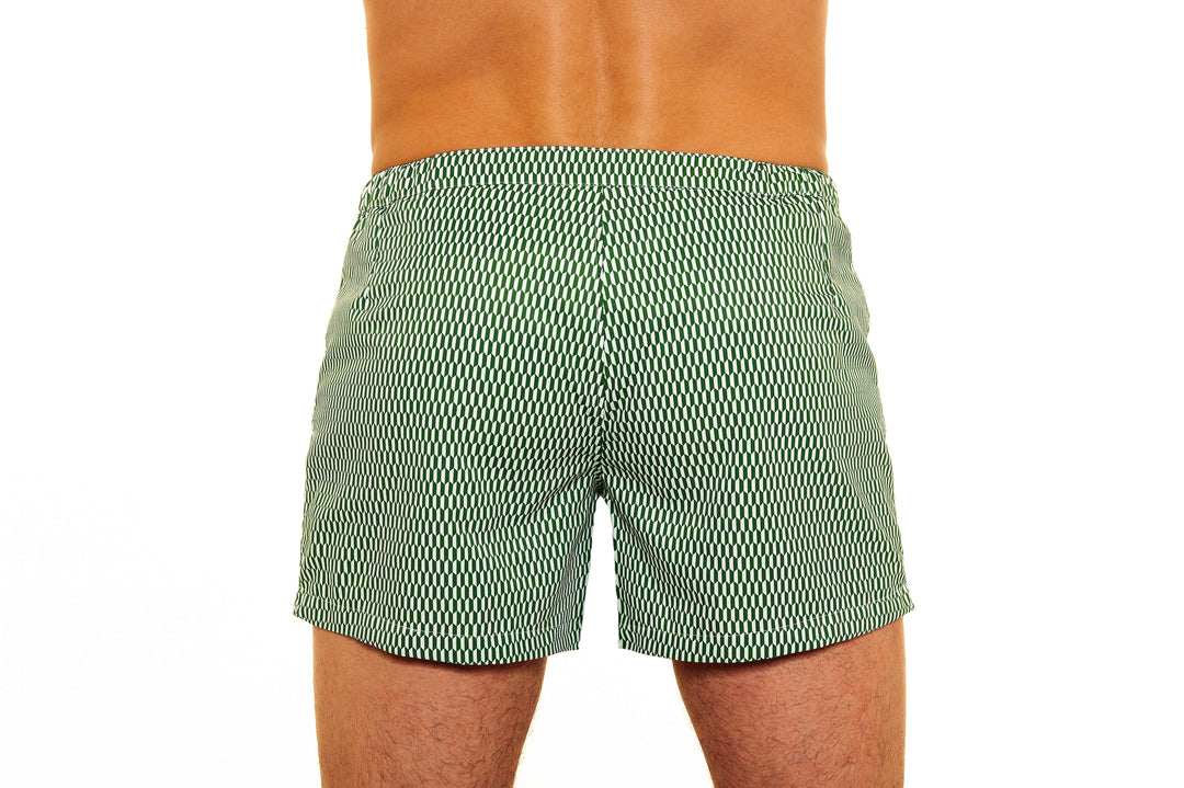 Rear view of person wearing green patterned swim trunks