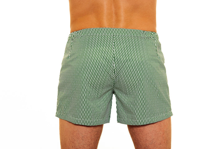 Rear view of person wearing green patterned swim trunks