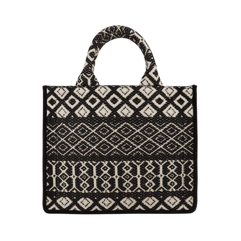 Black and white patterned tote bag with geometric designs