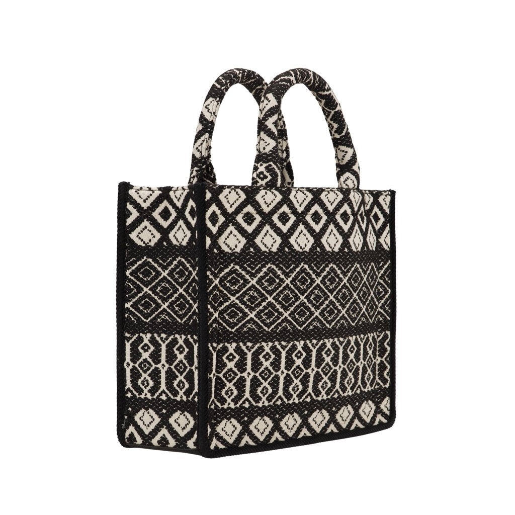 Black and white geometric patterned woven handbag with dual handles