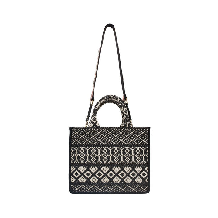 Handwoven black and white geometric pattern handbag with dual handles and shoulder strap