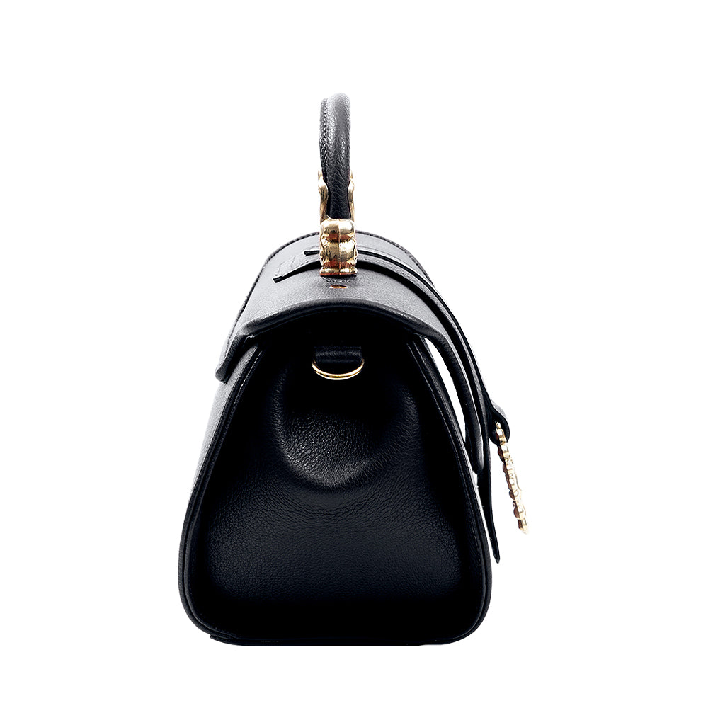 Side view of a black leather handbag with gold hardware