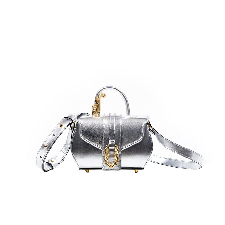 Silver luxury handbag with gold accents and adjustable strap