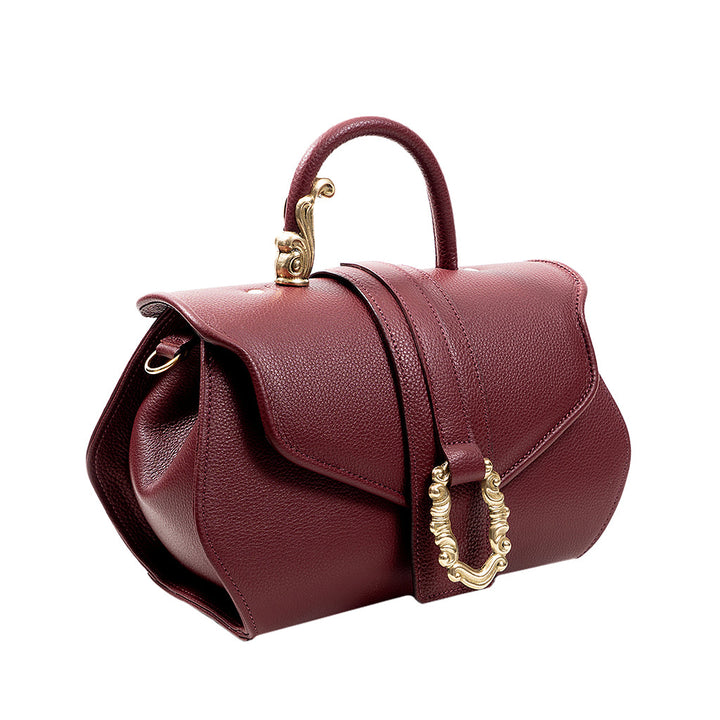 Elegant burgundy leather handbag with gold hardware and handle