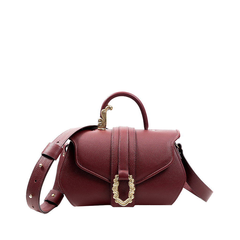 Burgundy leather handbag with gold clasp and adjustable shoulder strap