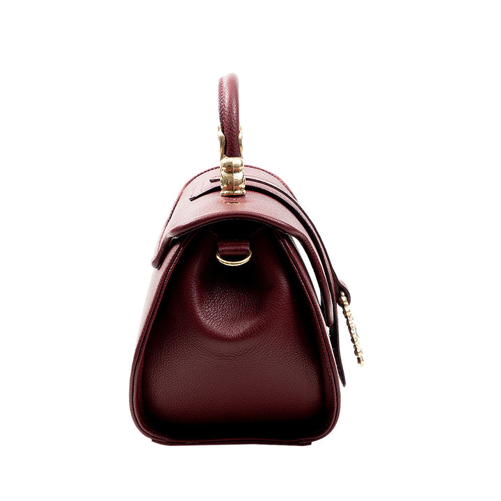 Side view of a maroon leather handbag with gold hardware