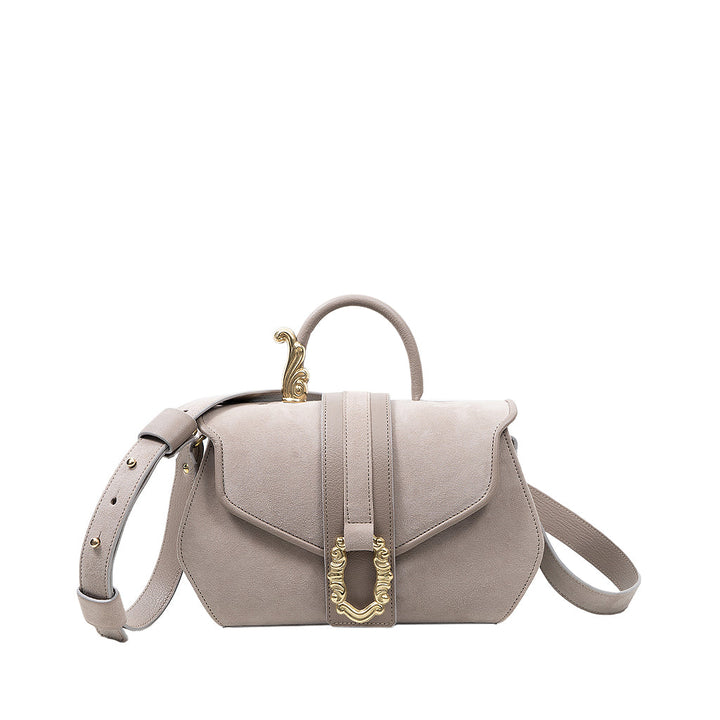 Elegant beige leather handbag with decorative gold buckle and adjustable shoulder strap