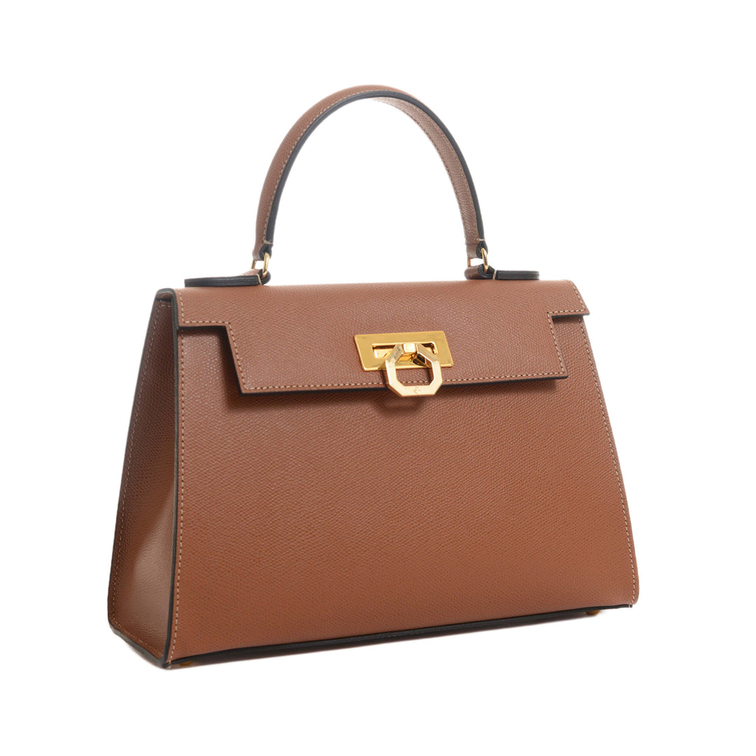 Brown leather handbag with gold clasp and top handle on white background