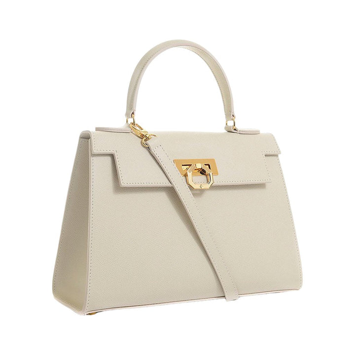 Elegant beige leather handbag with gold hardware and top handle