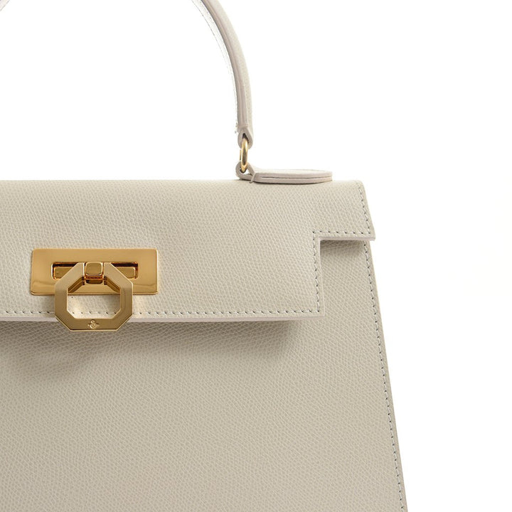 Elegant white leather handbag with gold hardware