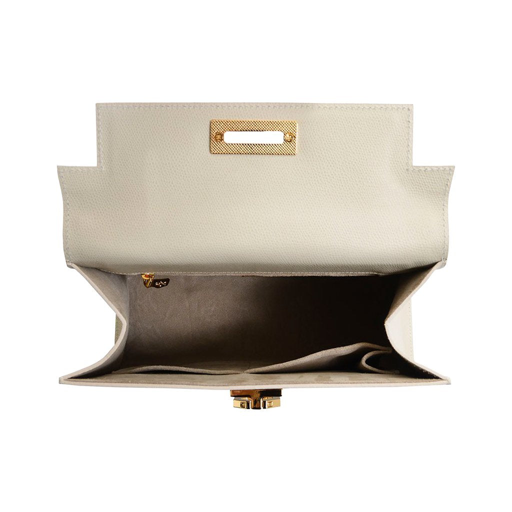 Open white leather handbag with gold hardware and spacious interior