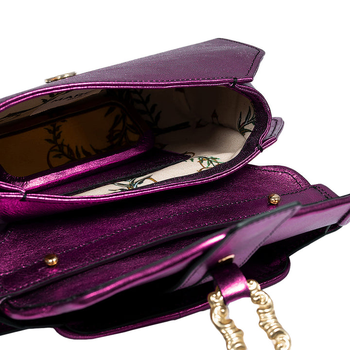Open purple leather handbag with floral lining and gold chain strap