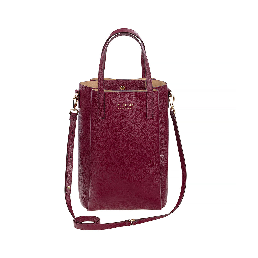 Elegant burgundy leather tote bag with adjustable shoulder strap and gold hardware