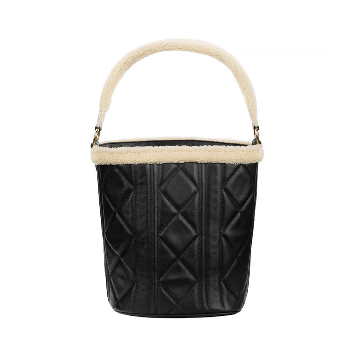 Black quilted leather bucket bag with white faux fur trim on handle and top