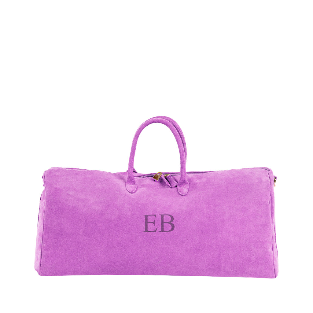Purple suede duffel bag with 'EB' monogram and handles