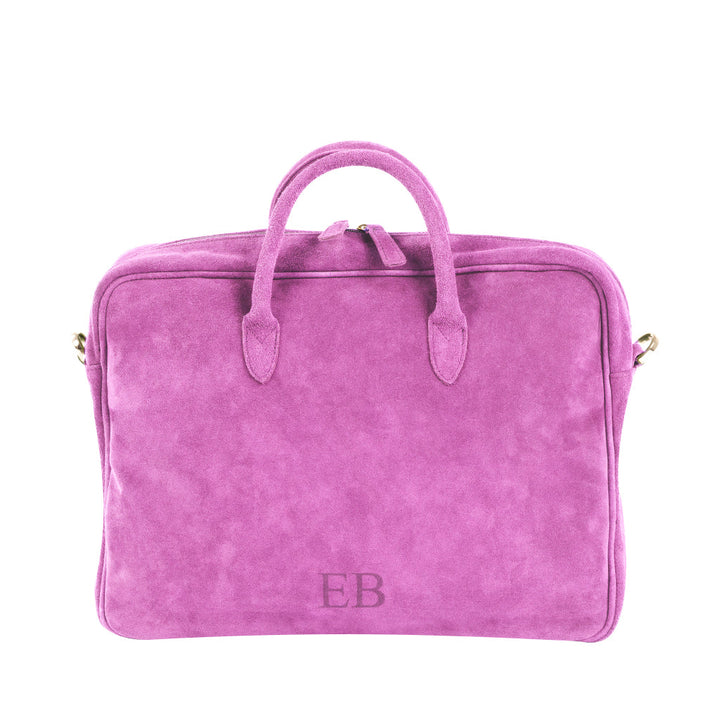 Bright pink suede handbag with initials EB embroidered on the front