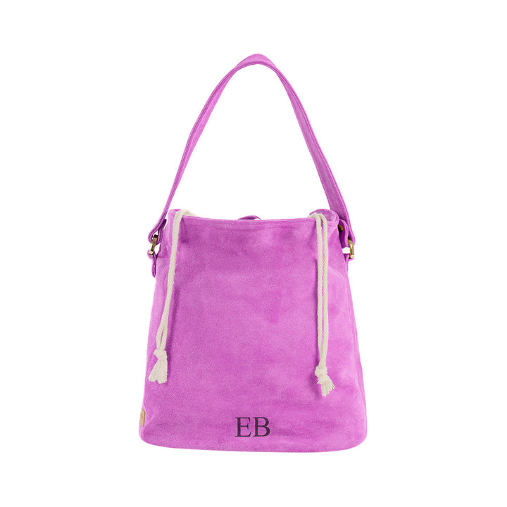 Bright pink suede tote bag with rope handles and EB initials on the front